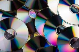 Photo of a pile of CDs and DVDs.