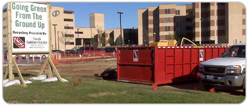 Exterior photo of Avera Mckennan Cancer Institute project with Novak rolloff container.