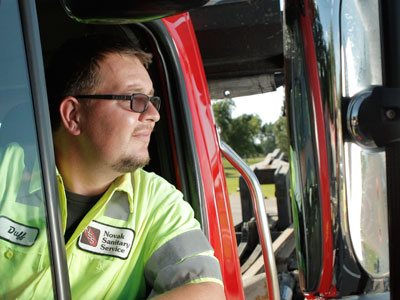 Photo of Novak Sanitary professional driver in truck.