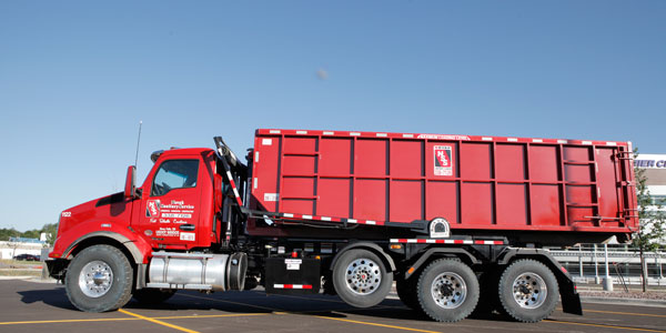 Image of Novak Sanitary Roll-off container truck.