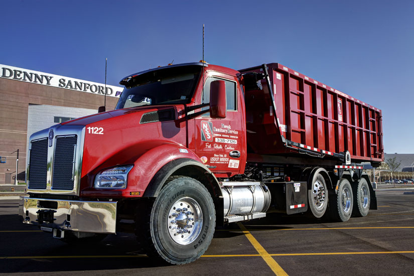 Image of construction roll-off container truck from Novak Sanitary.