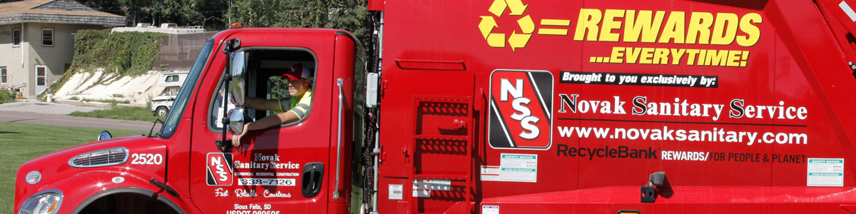 Image of Novak Sanitary truck and driver in Crooks, SD.